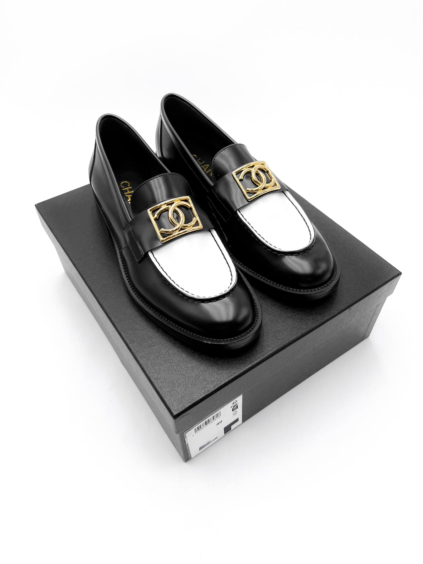 Chanel Black and White Loafers with Gold Hardware