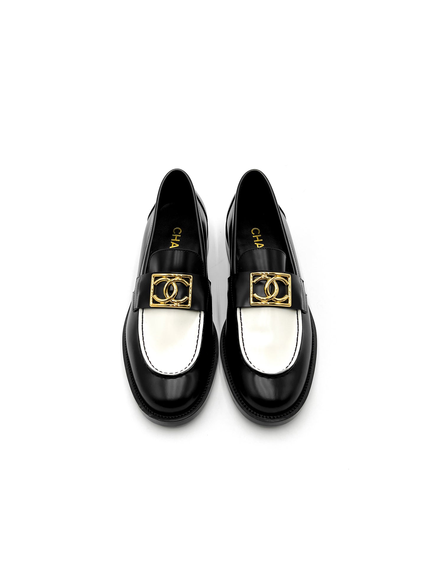 Chanel Black and White Loafers with Gold Hardware