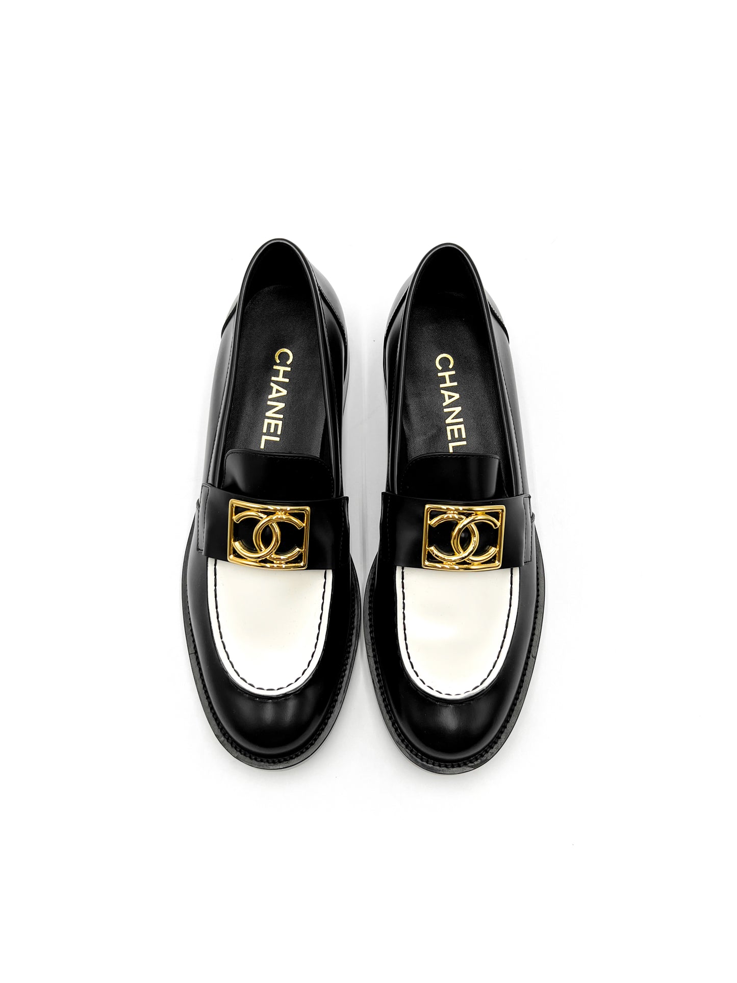 Chanel Black and White Loafers with Gold Hardware